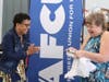 LAFCU’s Kelli Ellsworth Etchison surprises Pam Redman with an ATHENA Leadership Award pendant.