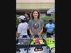 Everett High School student Teddy Holguin volunteers during the Back-to-School Extravaganza giveaway event, which provided essential supplies for 225 K-12 students from Lansing and surrounding areas. 