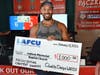 Three-time champion Akiem Harshman celebrates after earning a $1,000 donation for Judson Memorial Baptist Church during Paczki Palooza, with LAFCU partnering in the event to support the winning charity.