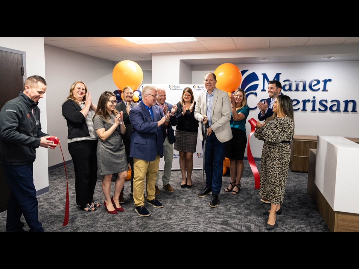 Maner Costerisan team members and community partners gathered to celebrate the firm’s new Grand Rapids office during a ribbon-cutting ceremony. 