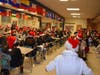 Lyons Township High School student volunteers serve as Santa's helpers awaiting their assignments at the Holiday Write Night North Pole.