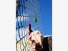 3D printed embellishments will be woven onto a chain link fence.