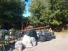Trash gathered at Shaw's near the river last September.