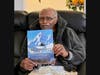Zackery Bouey proudly hold's daughter's recent literary release which places him as a main character.
