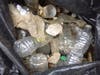 Plastic bottles styrofoam pieces stormwater runoff infecting Troy Brook
