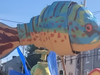 Giant puppets march in the procession.