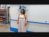 Adriene Evan models a formal dress she found at Goodwill’s Corporate Campus retail store