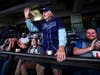 Veteran Tom Halliwell (standing) with Todd Hughes (seated, right), Goodwill’s Veterans Services Program manager, during a 2023 Tampa Bay Rays baseball game
