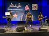 International speaker and South Florida musical artist Alexander Star (center) presented an upbeat and empowering musical keynote concert