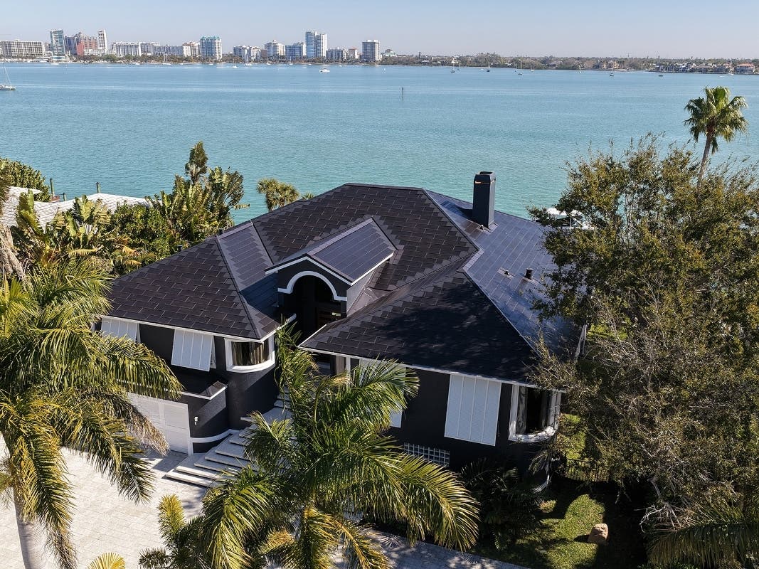 A Tesla Solar Roof installed by Roofing by Curry and Brilliant Harvest on Bird Key