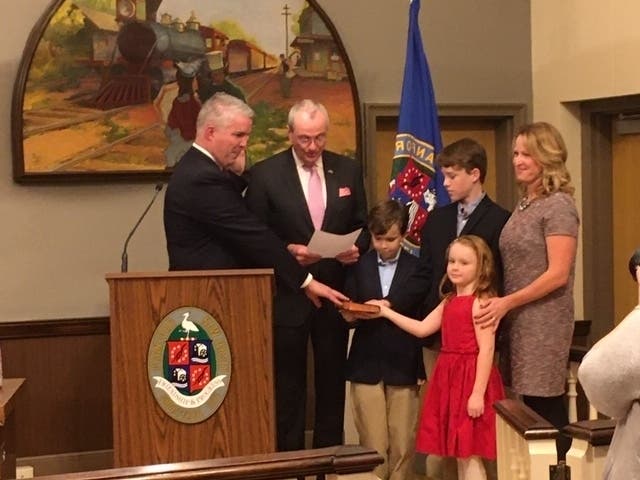 Patrick Giblin takes oath of office surrounded by his family and administered by Governor Phil Murphy.