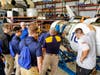 Instructor showing his NJROTC students the importance of proper maintenance on the aircraft