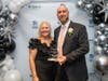 Liz DeCoursey, GMM Habitat CEO, congratulates John Pagano, Senior VP of Peoples Security Bank and Trust, who accepted the Community Champion Award at the Hearts and Hammers Gala. 