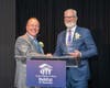 GMM Habitat Board President Gene Messina (left) congratulates Tom Miskewitz, CEO of Champion Container Corporation, recipient of the Professional Partner Award at the Hearts and Hammers Gala. 