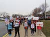 Students held up signs with words of strength to welcome Patrick to school.