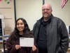 Marquette Bank Manager presenting Serena Rahahleh with the Adopt-A-Classroom Reward
