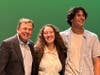 Rotarian Bob Kreisberg presents awards to Sage Creek High School students.