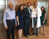 From left: Members of Om Parikh's family, Govinda Rajan, Krupa Parikh, Ketul Parikh and Yashaswi Parikh (far right), celebrate a signed agreement establishing the Memorial Fund with Pediatric Hematology/Oncology Division Chief Dr. Peter Cole.