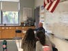 Medfield veteran Tom Sweeney talks with sixth grade students about his time serving in the military on Thursday, Nov. 7.