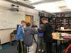 A team of BMS students work to build a marble run at the Hour of Code event.