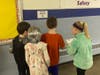 Wheelock students learning 100 day Fun Facts from QR code
