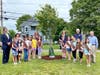 (L to R) Select Board Chair, Mike Marcucci, Medfield Postmaster Barbara Hynes, Troop leader Kate Holmes, Troop leader Pam McCarthy, DPW Director Maurice Goulet and Select Bd Member Pete Peterson surrounded by Brownie Troop 82076.