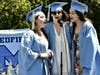 Medfield seniors Nicole Murray, Alessandra Kelley and Maria Neafus sing the National Anthem during the graduation ceremony held June 6.