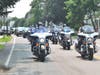 Motorcycle police escorting Capt. Harman