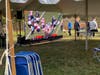 Big Screen under the outdoor tent showing N.E. Pats Game while waiting to vote.