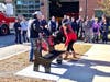 Louis Scaramuzzo and Leeann Bravo removing the cover to reveal the Memorial Bench