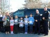 (Left to Right): Principal Holli Caulfield,  Emilie Cabezud, Anna Brehm, Shane Hartery,  Maggie Andrews, Kat Zheng, Chief Guerette and SRO Treggiari

