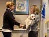 Town Clerk, Marion Bonoldi, shaking hands after swearing in Eileen Murphy as a member of the Board of Selectmen.