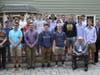 2nd Annual Phil Burr Senior Coffee in 2019, Phil Burr (seated) with MHS Class of 2019 and Erik Ormberg.