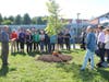 Selectman Gus Murby reading the Tree Proclamation in front of Blake Middle School.