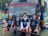 Medfield High School Warrior Football Captains and Seniors sitting on the Roche Bros RED ZONE Sideline Suite vehicle!