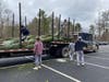 Lacrosse Team unloading trees