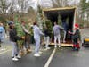 Lacrosse Team unloading trees