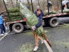 Lacrosse Team unloading trees
