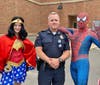 Deputy Police Chief Barry McGrath with his new friends Wonder Woman and Spider-Man