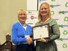 Nancy Irwin being congratulated by Gretchen Carey, President of MassRecycle.