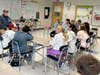 Army National Guard veteran Tom Sweeney talks with Blake Middle School sixth-graders.