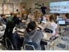 Coast Guard veteran Jim Mankus talks with Blake Middle School sixth-graders. 