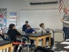 Army veteran Dean Putnam talks with Blake Middle School sixth-graders.