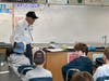 Navy veteran Jim Aldinger talks with Blake Middle School sixth-graders. 
