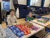Seventh-grader Mac McKinnon (left) and sixth-grader Alexander Frank, members of the Blood Drive Committee, assisted at the refreshment and recovery area. Fresh-baked goods and thank you cards were also available at the table.