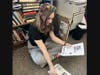 Sixth-grader Rori Disinger prepared flyers to be handed out to students as part of the donor recruitment process in the months before the blood drive.