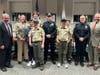 Promotion of MPD Francis Thisse (in center) to Sergeant by Deputy Chief Barry McGrath (2nd from right).