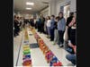 Thomas Blake Middle School sixth-grade students created a cereal domino maze with boxes collected for donation.