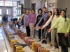The cereal boxes were lined up like dominoes and knocked down while the sixth-grade students were able to watch.