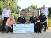 (left to right) Medfield Lions Club President, Chris Carlin, Lions Treasurer, John Carey, MPD Sgt. Francis Thisse, MPD Officer Rob Hain, MPD Canine Nova, MPD Officer Timothy Reilly and Lions Secretary, Russ Hallisey.